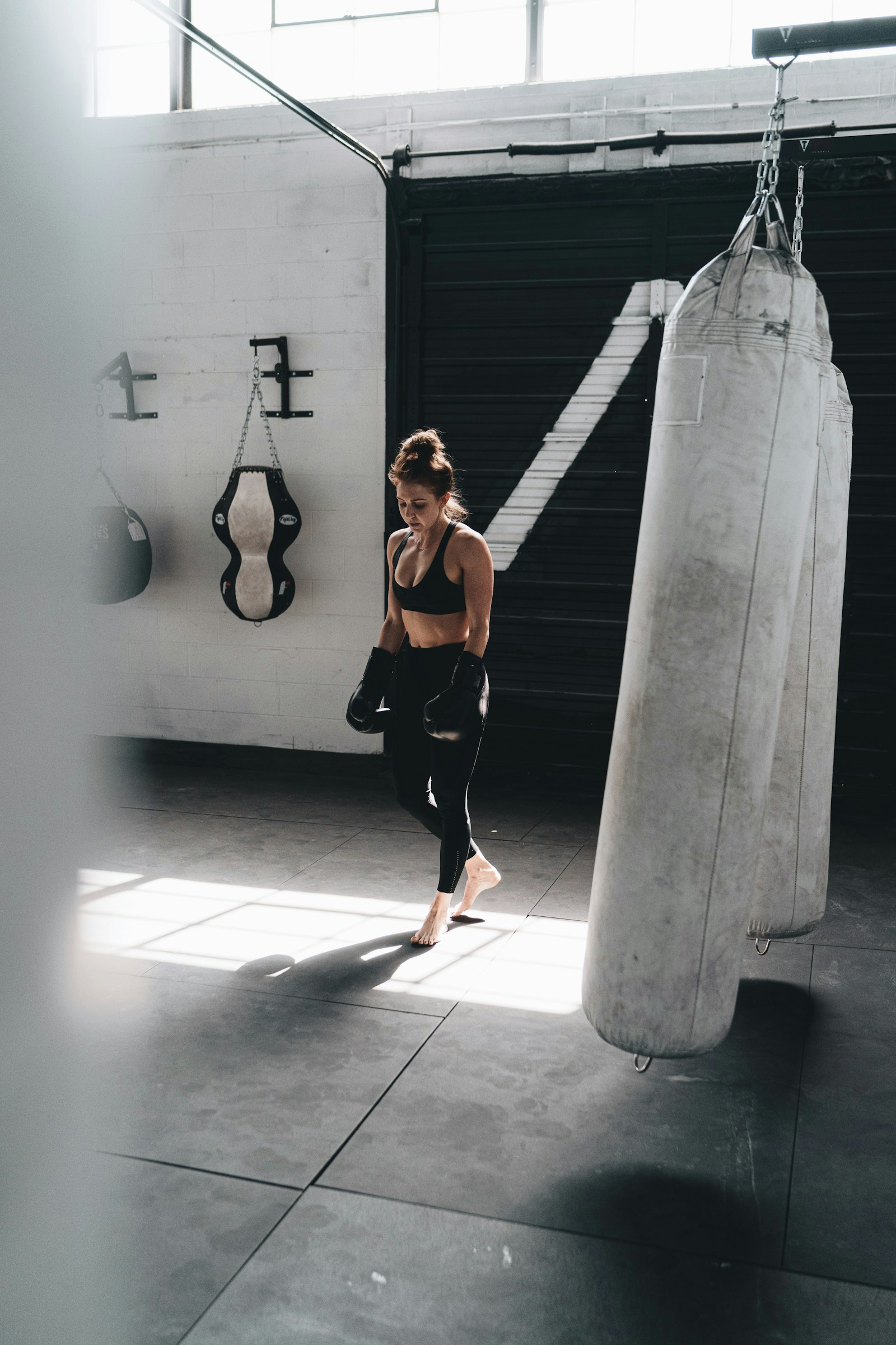 Member beside a heavy bag